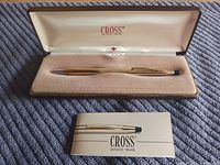 Pen in open case with booklet