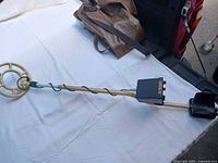 Full view of Fisher 1266X metal detector showing shaft, coil and carry bag