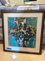 Front view of framed cat-themed artwork showing full design and condition.
