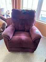 Front view of maroon La-Z-Boy power recliner showing plush padded arms and backrest