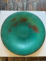 Top view showing full turquoise mottled charger with fish inlay