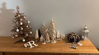 overall lot showing gold tree, bottle brush trees, letter R, star candle holder, baubles and lantern