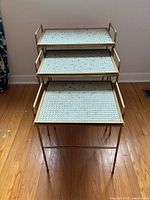 Front view showing all three stacking tables