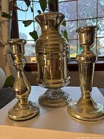 Front view of vase and both candlesticks