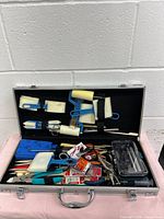 Open case showing quantity and variety of art tools