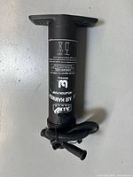 Full view of pump showing hose and nozzle