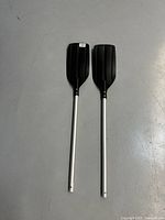 Two paddle halves laid flat showing full length