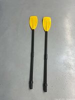 Full view of both assembled oars showing length and overall condition