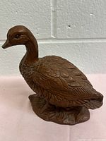 Full side view of Red Mill bird figurine