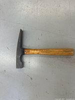 Full view of hammer showing head shape and wooden handle