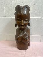 Front view of carved hardwood female bust