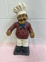 Front view of carved wood chef figurine