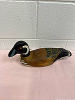 Left-side view of painted wooden duck decoy