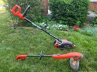 Photo shows both Black & Decker Edge Hog lawn edger and electric string trimmer on grass, demonstrating the full size and condition of both items.