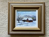 Frontal view showing overall miniature oil painting of a snowy cabin scene in winter, signed by EC Thurloe.