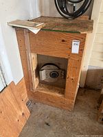 Wooden cabinet with built-in safe inside, showing the overall installation and construction.