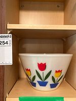 Single large bowl on shelf showing tulip pattern