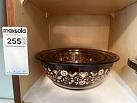 Single large brown Pyrex mixing bowl showing the amber Festive Harvest floral and heart design