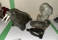 overview of four soapstone animal carvings