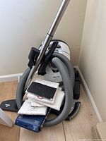 Overview of vacuum, hose, wand, bags and attachments