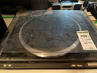 Technics SL-BD20D automatic turntable with closed dust cover showing dust and fingerprints