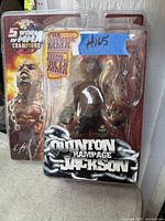 Sealed Quinton 'Rampage' Jackson MMA action figure with vibrant packaging showing champion status and official MMA branding.