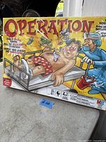 Photo of Operation game box new in unopened condition with colorful cartoon graphics