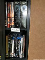 Shelf showing individual James Bond DVDs and additional movie DVDs