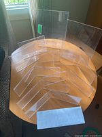 All ten clear acrylic frames arranged on tabletop