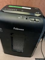 Front view Fellowes 10M shredder showing window and brand logo