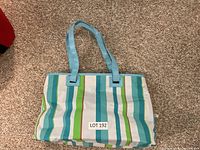 Full view of striped beach tote bag exterior
