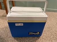 Front view of blue Thermos SunPacker cooler with handle and lid