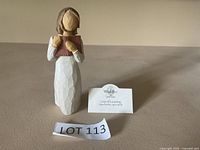 Front view of Willow Tree Love of Learning figurine with tag