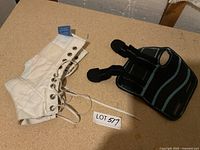 wrist brace and ankle brace laid on tabletop