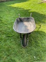 Front view of Yardworks wheelbarrow showing tray and wheel