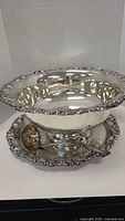 Large silver plated punch bowl on matching undertray