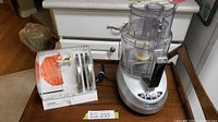 Overall view of Cuisinart food processor and accessory holder on kitchen counter