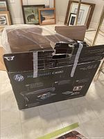 Closed original HP Photosmart C4680 printer box showing external branding and model.