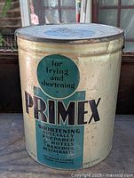Front side view of the large Primex shortening tin showing text and graphics.