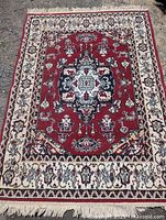 Full view of the rectangular vintage Persian style rug laid out, showing vibrant colors and detailed pattern.