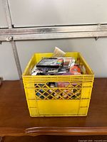 Full view of yellow crate on table