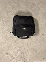 Closed black carrying case front view