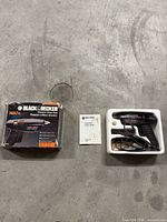 Black & Decker electric disc gun in styrofoam tray with power cord, instruction manual, original box