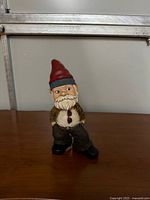 Front view of painted resin bobble head gnome