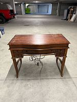 Front view of wooden writing desk
