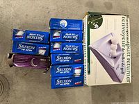 Auto-return putting machine box, six Srixon Hi-Spin golf ball boxes, one extra sleeve