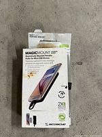 Retail package of Scosche MagicMount PowerBank shown front view