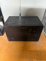 Closed black wooden storage chest