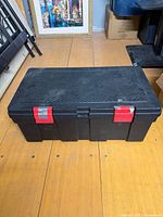 Closed black toolbox showing exterior and latches