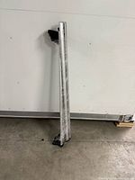 Full view of roof rack crossbar standing upright